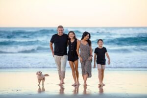 Family walking together on the beach